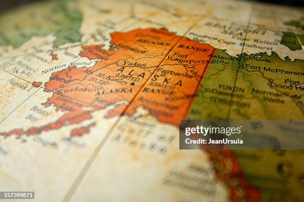 globe map drawing focused on alaska - ak stock pictures, royalty-free photos & images
