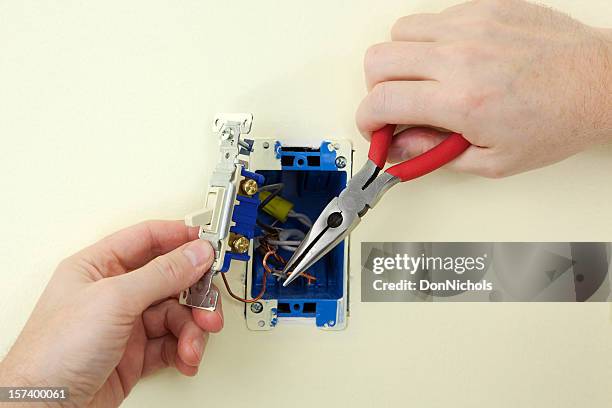 electrician replacing a switch - light switch stock pictures, royalty-free photos & images