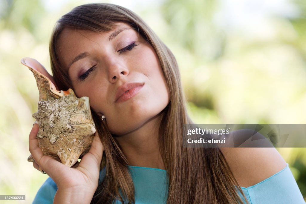 Listening To Shell High-Res Stock Photo - Getty Images