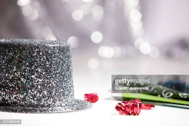 2012 new year's top hat and party horn blowers, copyspace - silver hat stock pictures, royalty-free photos & images