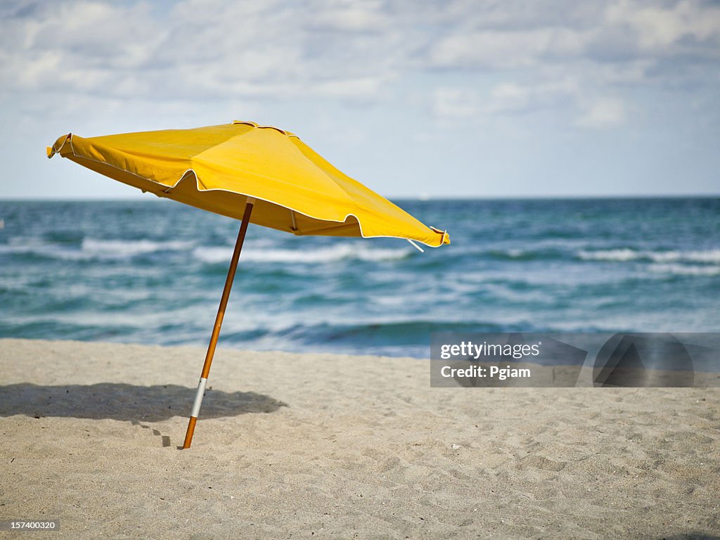 Sunchairs and umbrella on Beach