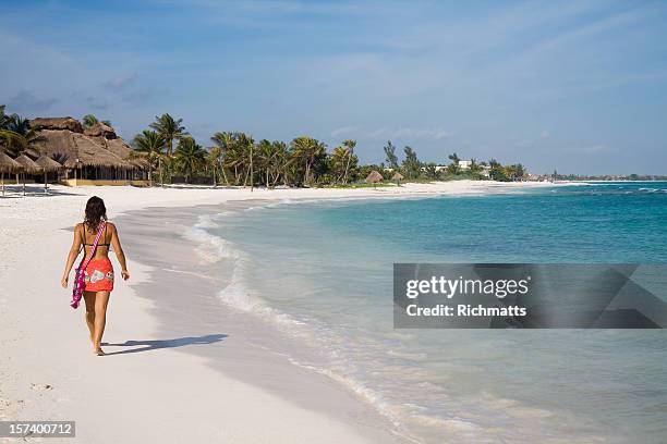 lady walking alone on the beach - mayan riviera stock pictures, royalty-free photos & images