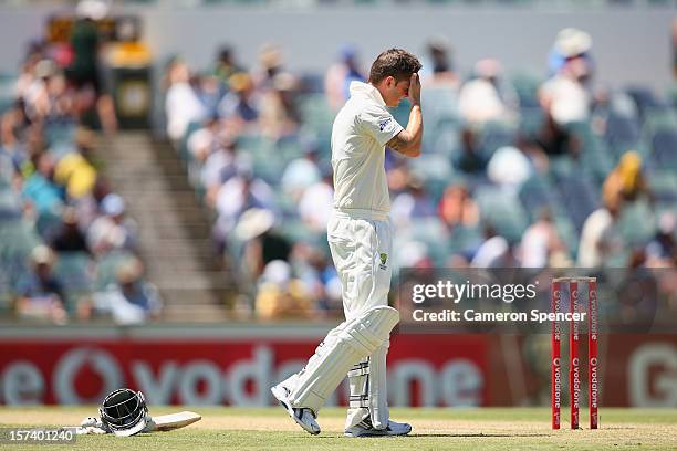 Australian captain Michael Clarke feels the heat during day four of the Third Test Match between Australia and South Africa at the WACA on December...