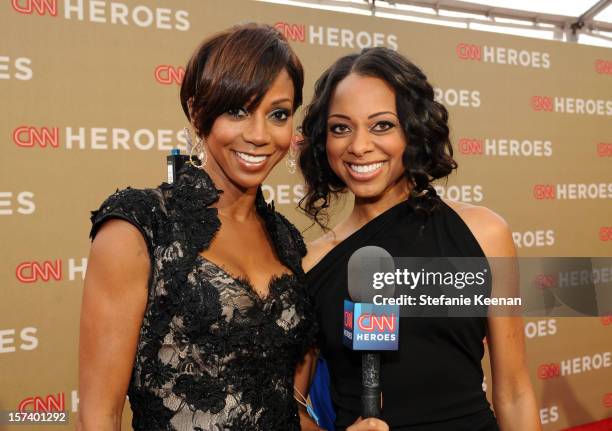 Actress Holly Robinson Peete and carpet hostess Nischelle Turner attend the CNN Heroes: An All Star Tribute at The Shrine Auditorium on December 2,...