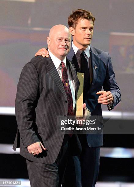 Honoree Leo McCarthey of Mariah's Challenge and actor Josh Duhamel onstage during the CNN Heroes: An All Star Tribute at The Shrine Auditorium on...