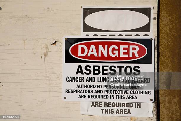 danger asbestos warning sign - asbestos stock pictures, royalty-free photos & images