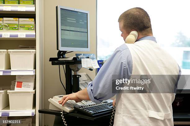 pharmacist at the drive-through window - drive through pharmacy stock pictures, royalty-free photos & images