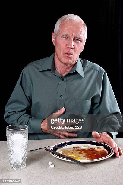indigestion after a meal. - bulging belly stock pictures, royalty-free photos & images