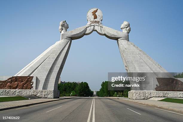 the reunification monument in pyongyang - north korea capital stock pictures, royalty-free photos & images