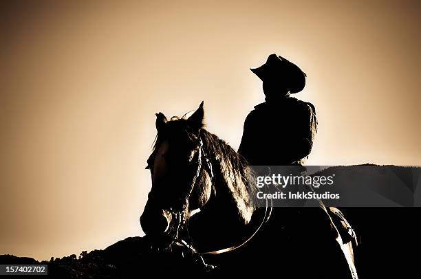 tramonto rider - cowboy sillouette foto e immagini stock