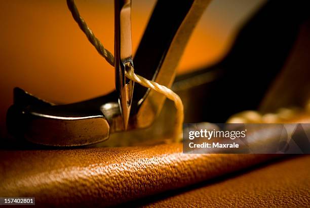 sewing needle of sewing machine making stitches - sewing machine stock pictures, royalty-free photos & images