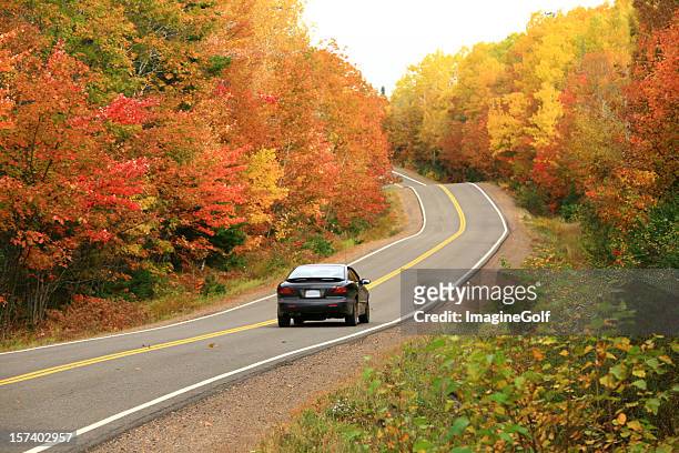 car driving on remote appalachian highway in fall - country road stock pictures, royalty-free photos & images