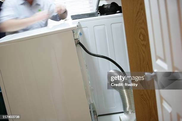 washer dryer repair in motion - air duct repair stock pictures, royalty-free photos & images