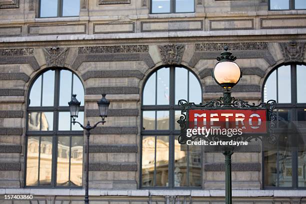 paris metro sign against the louvre, france - the louvre stock pictures, royalty-free photos & images