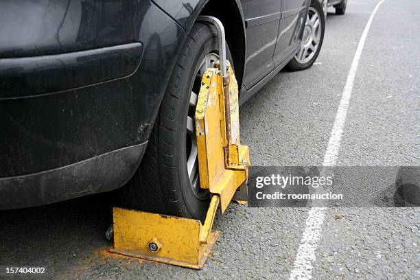 clamped wheel - car boot stock pictures, royalty-free photos & images