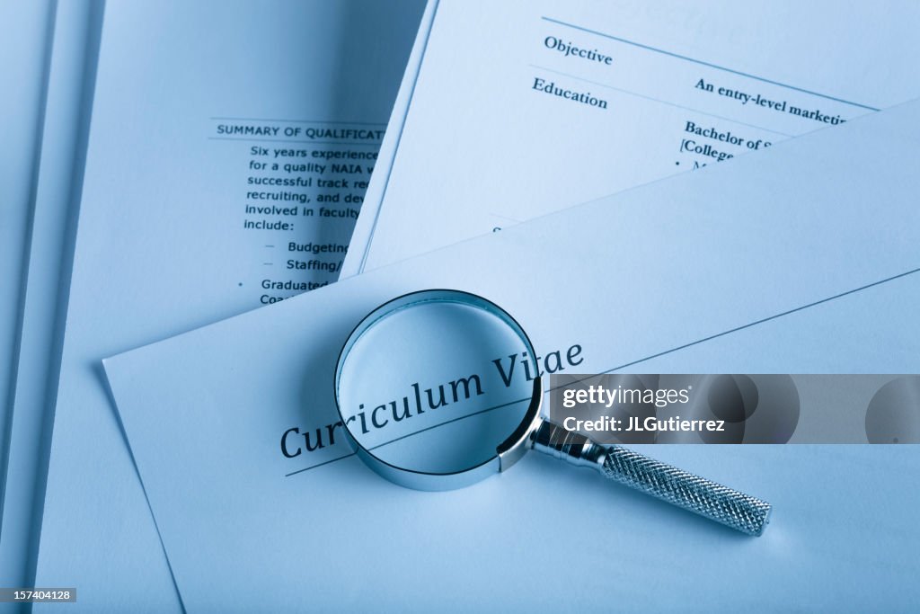 A curriculum vital and a magnifying glass