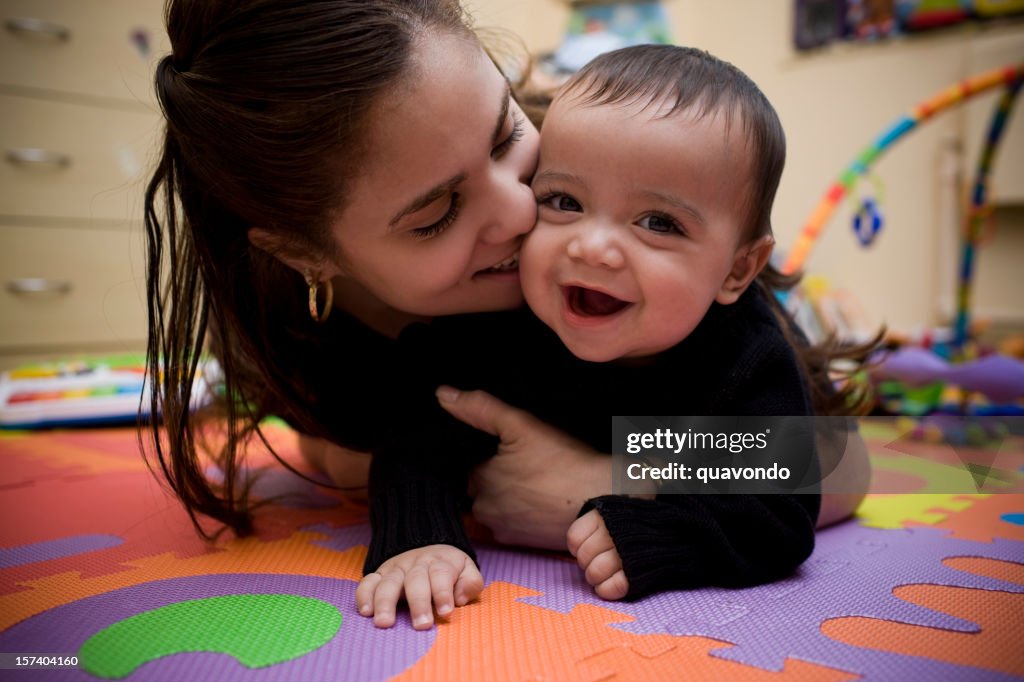 Adorable Hispanic Young Mother and Son in Home Playroom