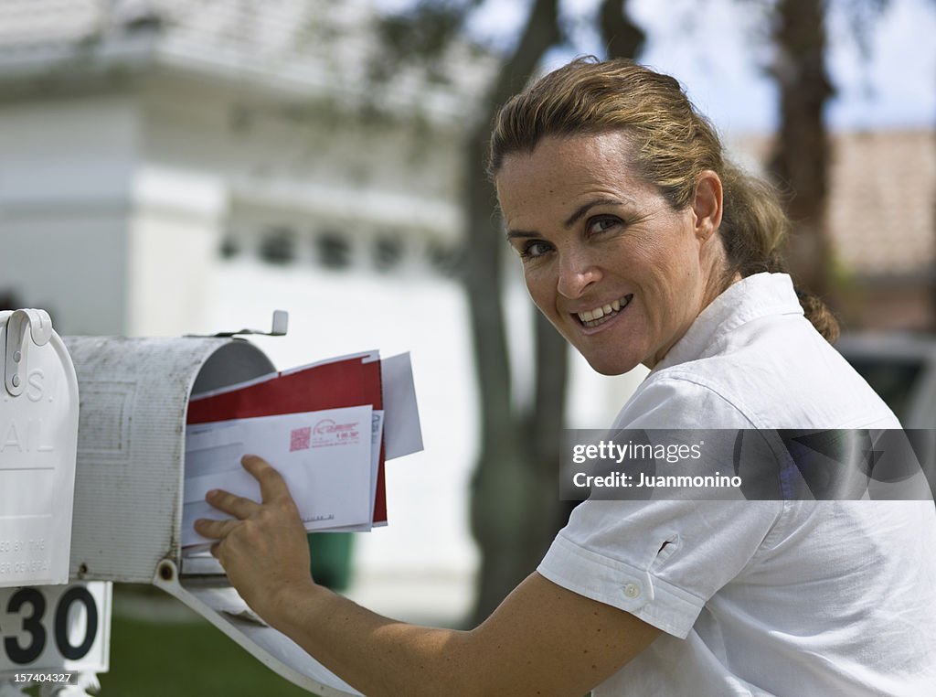 Woman picking up the mail