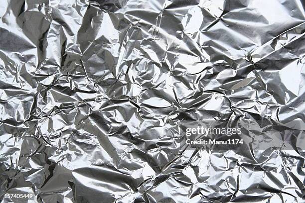 isolated image of crumpled aluminum foil - aluminum stock pictures, royalty-free photos & images