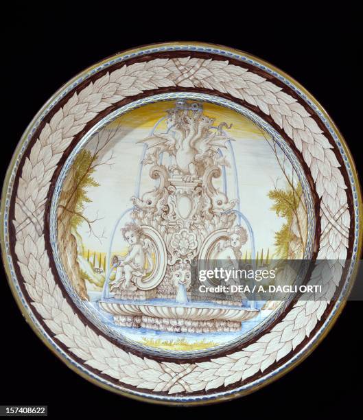 Plate decorated with baroque fountain, milk-coloured maiolica, Angarano manufacture, Veneto. Italy, 17th century. Milan, Castello Sforzesco, Civiche...