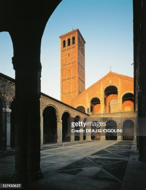 Canonical bell tower and church facade seen from the atrium of Ansperto, Basilica of Sant'Ambrogio, Milan. Italy, 4th century.
