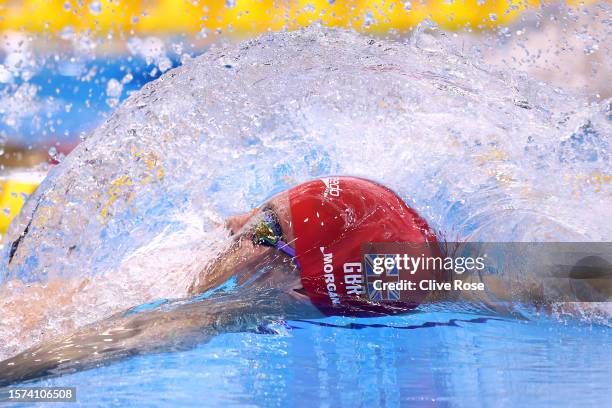 Oliver Morgan of Team Great Britain competes in the Men's 200m Backstroke Semifinal on day five of the Fukuoka 2023 World Aquatics Championships at...