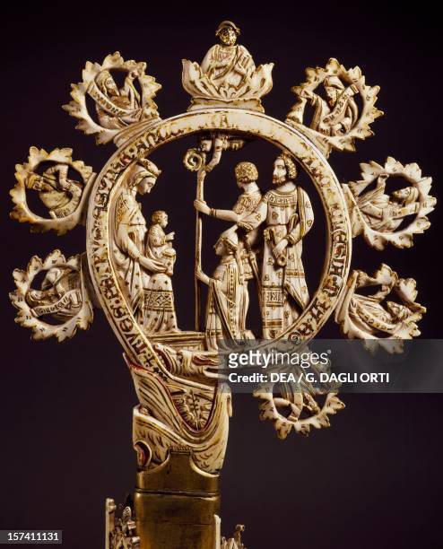 Crook from a crosier with the Madonna and Child being adored by a bishop, artist from a Venetian School, ivory. Italy, 14th century. Florence, Museo...