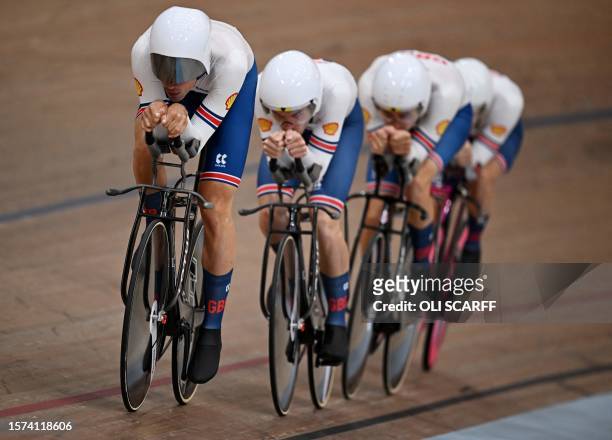 Great Britain take part in a men's Elite Team Pursuit qualification race at the Sir Chris Hoy velodrome during the UCI Cycling World Championships in...