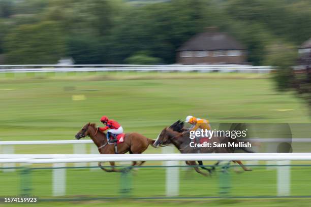 Hollie Doyle on Libra Tiger followed by William Carson on Cabeza De LLave compete in The Racing TV Handicap Stakes at Sandown Park on July 27, 2023...