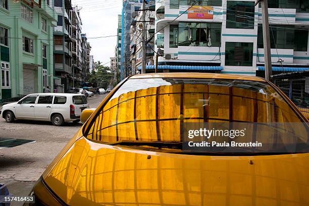 Cars are parked at the Htoo Auto Service workshop November 29, 2012 Yangon, Myanmar. Import restrictions have been eased resulting in many new cars...