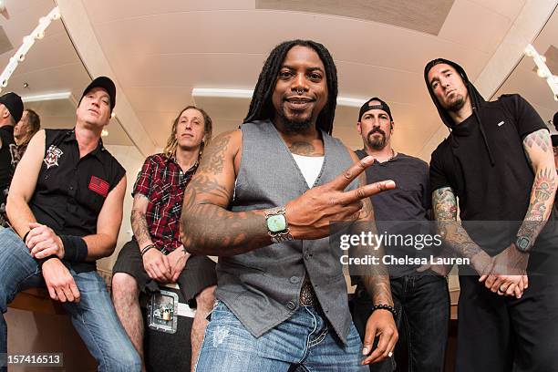 Bassist Vince Hornsby, drummer Morgan Rose, vocalist Lajon Witherspoon, guitarist John Connolly and guitarist Clint Lowery of Sevendust pose onboard...