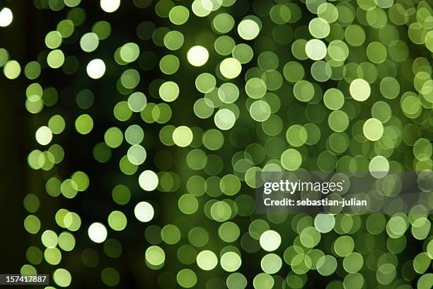 large group of unfocused green light dots xxxl - kelly green stock pictures, royalty-free photos & images