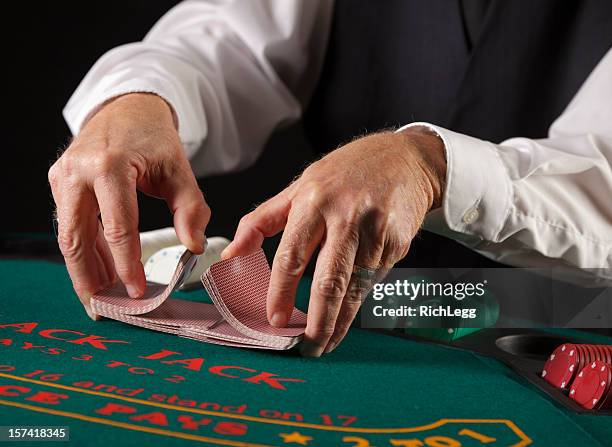 close up of poker player's hands - blackjacks stock pictures, royalty-free photos & images