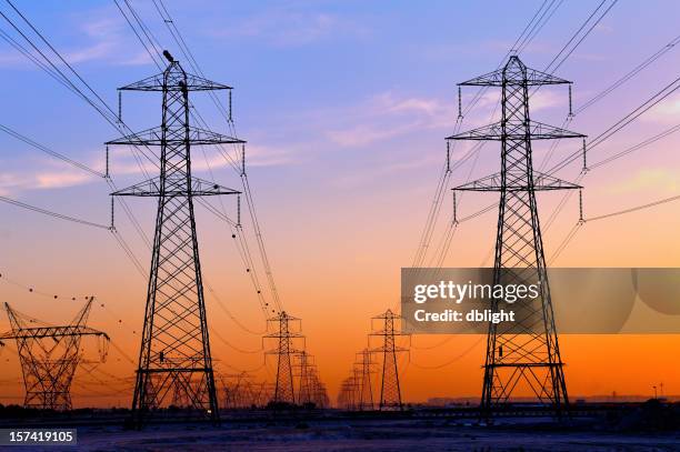 pylon in colored sky - power supply stock pictures, royalty-free photos & images