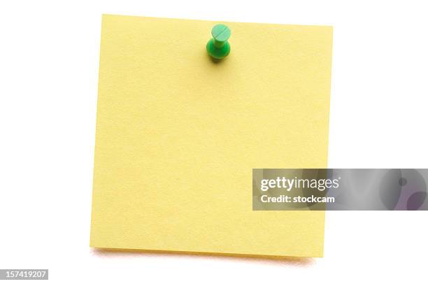 yellow post-it with push pin isolated on white - push pin stockfoto's en -beelden