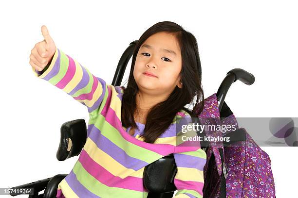 little girl in wheelchair giving thumb's up - giving a girl head stock pictures, royalty-free photos & images