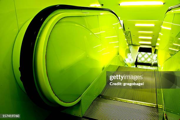 green escalator in downtown branch of seattle public library - seattle center stock pictures, royalty-free photos & images