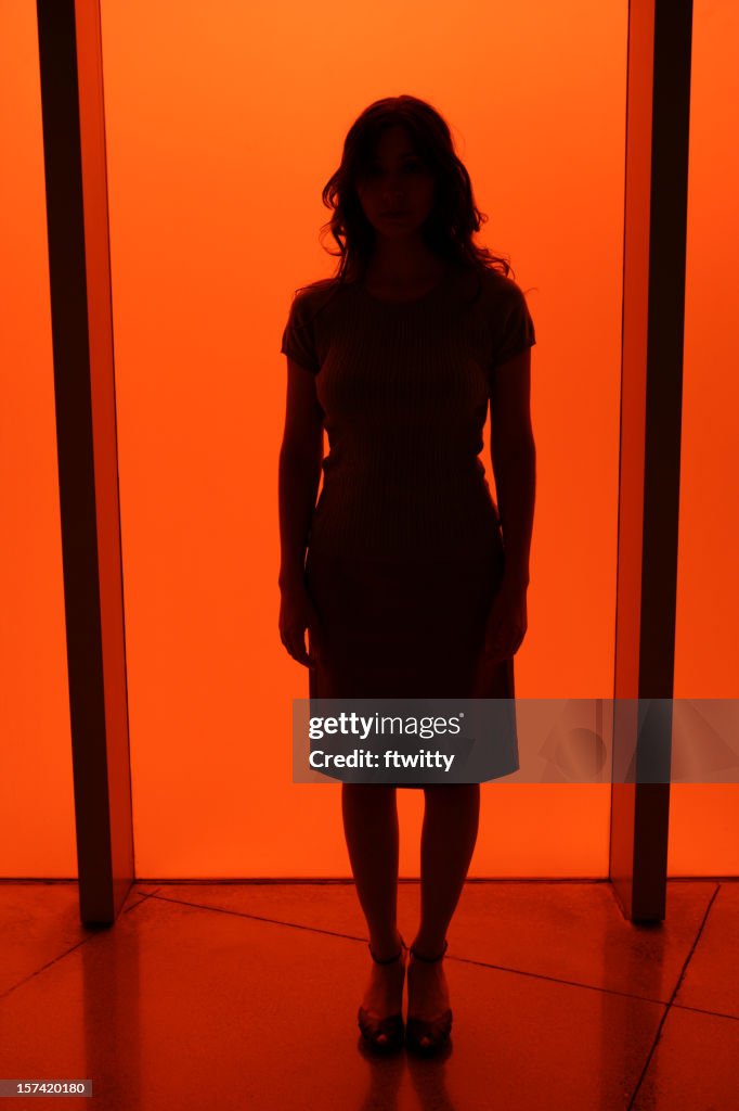 Silhouette of a woman in red light