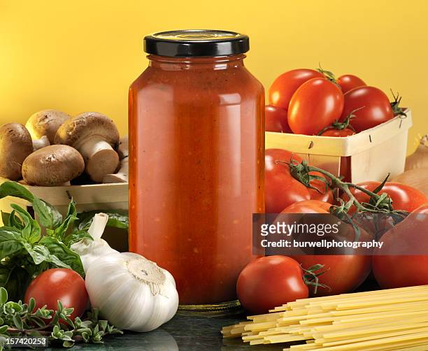 bottled pasta sauce with raw ingredients - sauce stock pictures, royalty-free photos & images