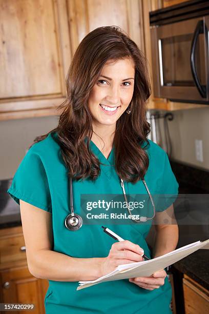 home healthcare worker - doctor scrubs stock pictures, royalty-free photos & images