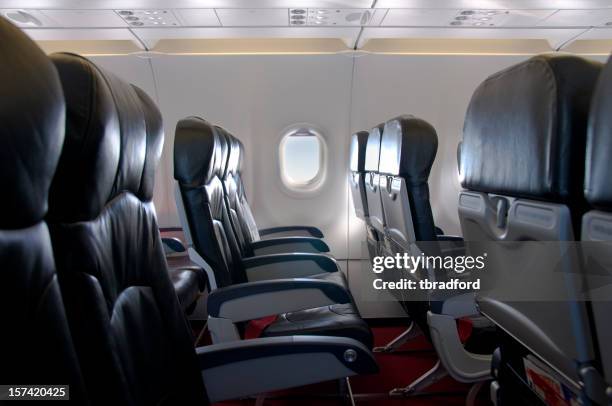 premium economy class seating inside an airplane cabin - seat stock pictures, royalty-free photos & images