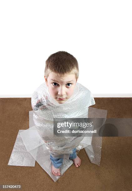 bubble wrapped - child bubble wrap stock pictures, royalty-free photos & images
