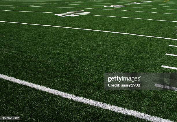 football field forty yardline artificial turf - american football stadium background stockfoto's en -beelden