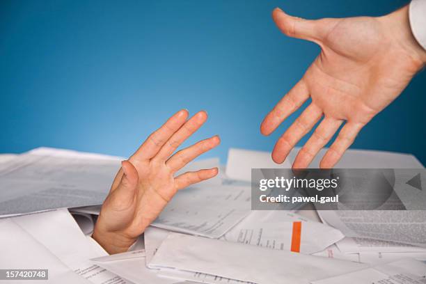 financial help - buried paperwork stock pictures, royalty-free photos & images