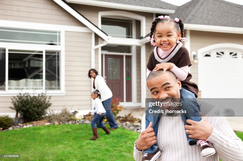 Playful Family of Four at Home