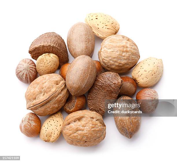 mixed nuts in the shell - nutshell stock pictures, royalty-free photos & images