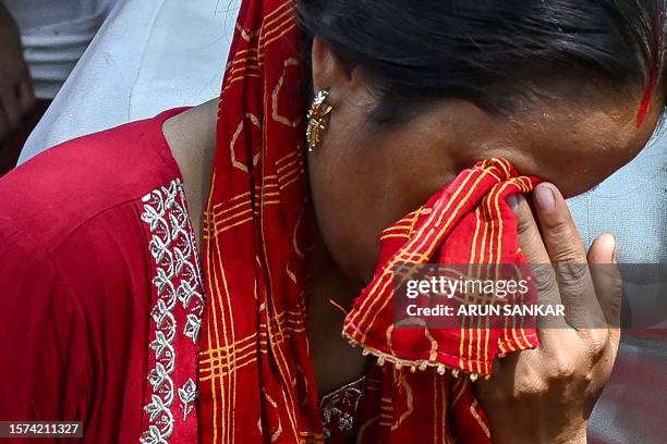 Members of tribal community gestures during protest over violence against women and for peace in the ongoing ethnic violence in India's north-eastern...