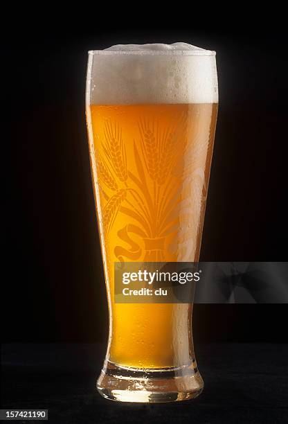 glass of beer - wheat beer stock pictures, royalty-free photos & images