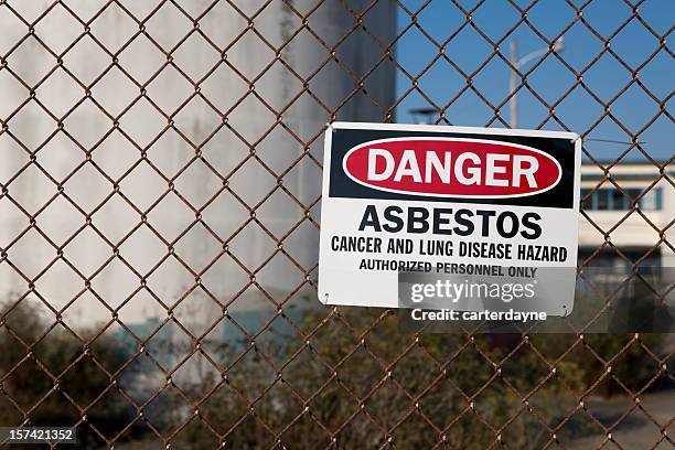 danger asbestos warning sign - asbestos stock pictures, royalty-free photos & images