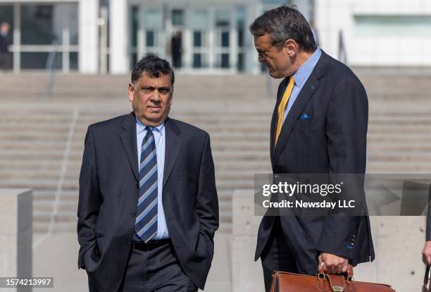 Harendra Singh, leaves with his attorney Anthony LaPinta after being sentenced by U.S. District Judge Joan Azrack at the Federal Courthouse in...